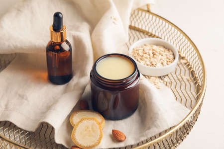 Composition with banana cosmetics on light background, closeupの写真素材