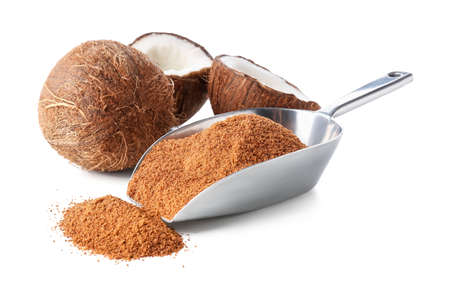 Sweet coconuts and sugar on white background