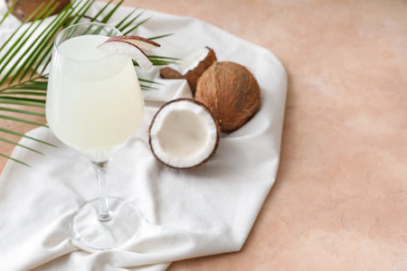 Glass of fresh coconut water on tableの写真素材