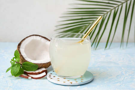 Glass of fresh coconut water on tableの写真素材