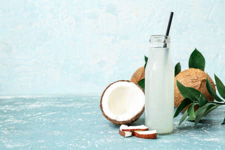 Bottle of fresh coconut water on tableの写真素材