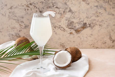 Glass of fresh coconut water on tableの写真素材