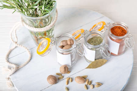 Composition with different spices on light wooden backgroundの写真素材