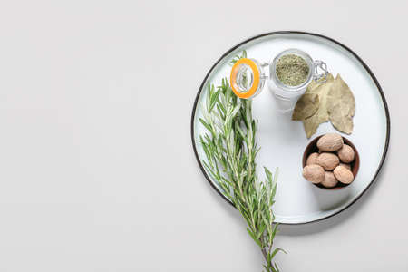 Tray with different spices on light backgroundの写真素材