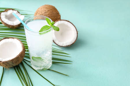 Glass of fresh coconut water on tableの写真素材