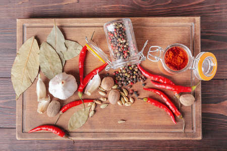 Composition with different spices on wooden backgroundの写真素材