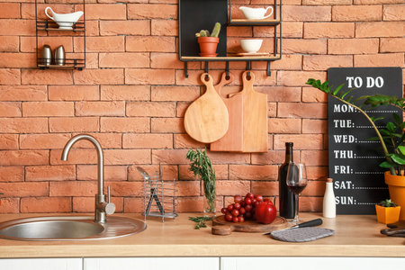 Cooking utensils and products on table in modern kitchenの写真素材