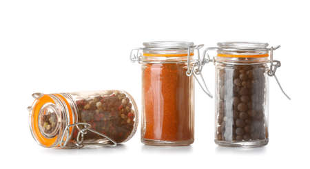 Jars with different spices on white backgroundの写真素材