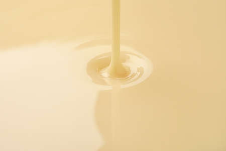 Sweet condensed milk as backgroundの写真素材
