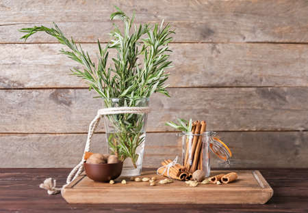 Composition with different spices on wooden backgroundの写真素材