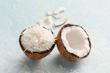 Coconut with flakes on light backgroundの写真素材