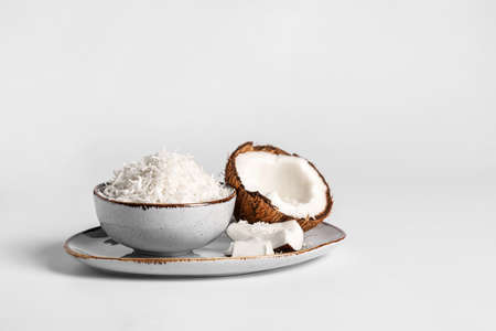 Plate with coconut flakes on white backgroundの写真素材
