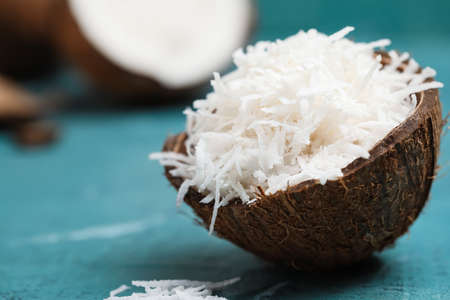 Coconut with flakes on color backgroundの写真素材