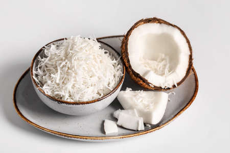 Plate with coconut flakes on white backgroundの写真素材
