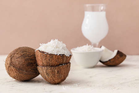 Coconut with flakes on light tableの写真素材