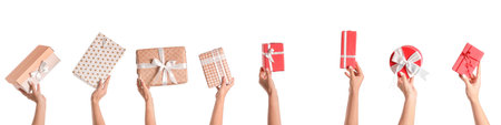 Female hands with gift boxes on white backgroundの写真素材