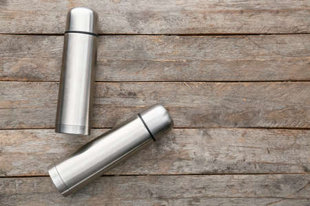 Modern flasks on wooden backgroundの写真素材