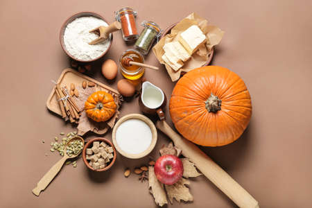 Ingredients for preparing pumpkin pie on color backgroundの写真素材