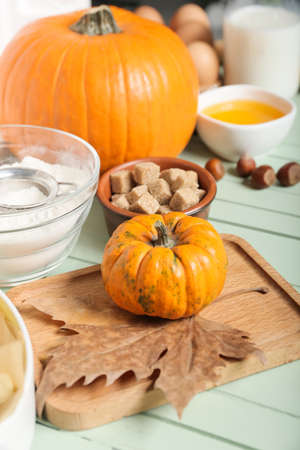 Ingredients for preparing pumpkin pie on color wooden backgroundの写真素材