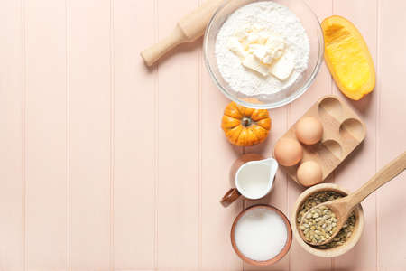 Ingredients for preparing pumpkin pie on color wooden backgroundの写真素材