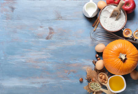 Ingredients for preparing pumpkin pie on color wooden backgroundの写真素材