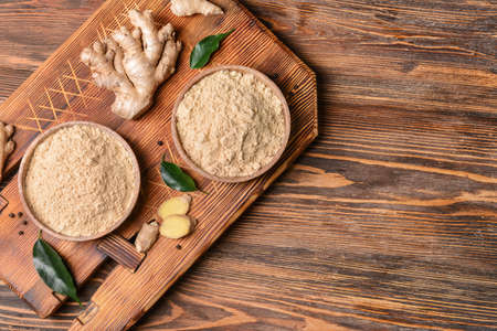 Composition with ginger powder on wooden backgroundの写真素材