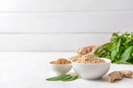 Composition with ginger powder on light backgroundの写真素材