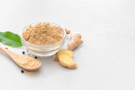 Composition with ginger powder on light backgroundの写真素材