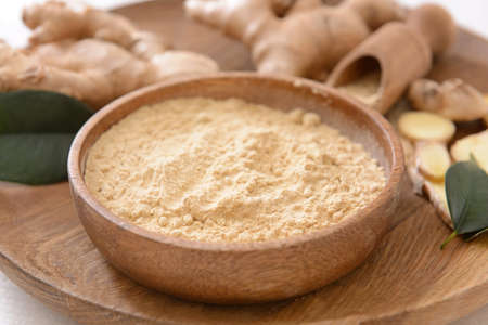 Bowl with ginger powder, closeupの写真素材