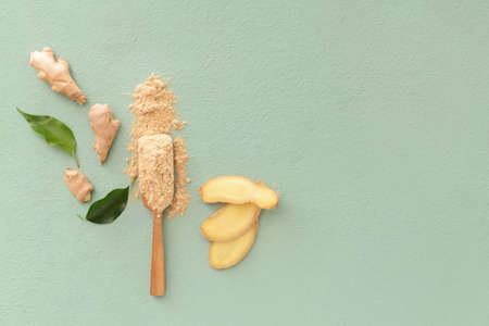 Composition with ginger powder on color backgroundの写真素材