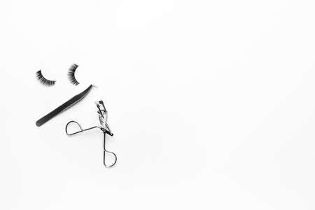 False eyelashes and curler on white backgroundの写真素材