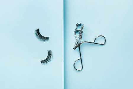 Curler and false eyelashes on color backgroundの写真素材