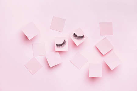Creative composition with false eyelashes on color backgroundの写真素材