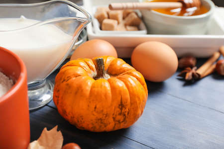 Ingredients for preparing pumpkin pie on color wooden backgroundの写真素材
