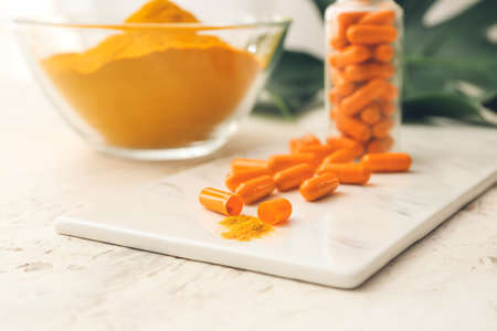 Turmeric pills on light backgroundの写真素材
