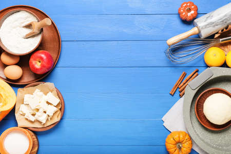 Ingredients for preparing pumpkin pie on color wooden backgroundの写真素材