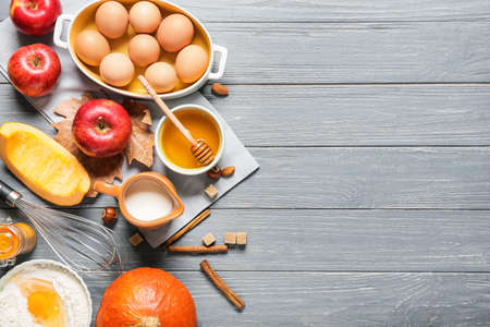 Ingredients for preparing pumpkin pie on wooden backgroundの写真素材