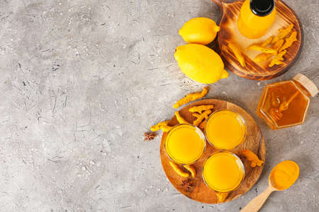Healthy turmeric drink on grunge backgroundの写真素材