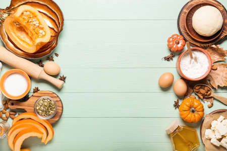 Ingredients for preparing pumpkin pie on color wooden backgroundの写真素材