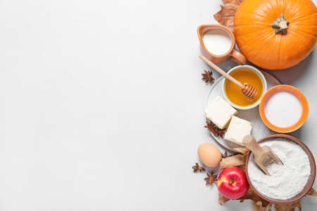 Ingredients for preparing pumpkin pie on light backgroundの写真素材