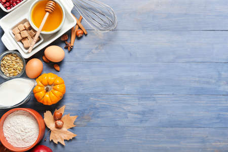 Ingredients for preparing pumpkin pie on color wooden backgroundの写真素材