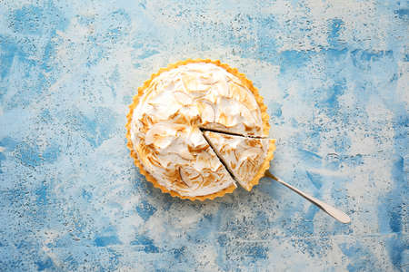 Tasty coconut pie on color backgroundの写真素材