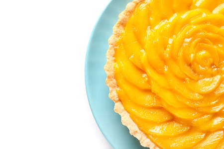 Plate with tasty mango pie on white backgroundの写真素材