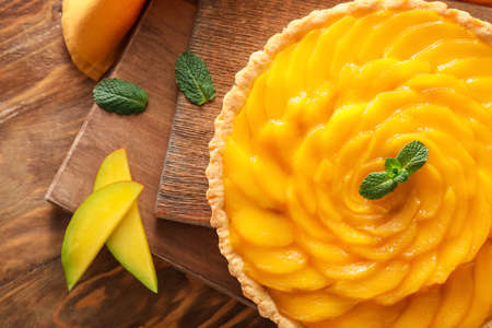 Tasty mango pie on wooden backgroundの写真素材