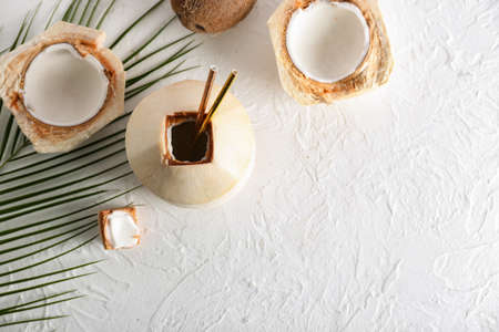Fresh and ripe coconuts on light backgroundの写真素材