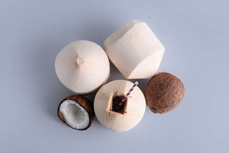 Fresh and ripe coconuts on light backgroundの写真素材