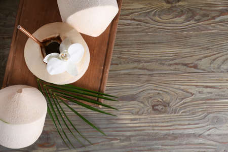 Fresh coconuts on wooden backgroundの写真素材