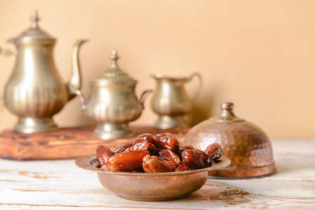 Composition with sweet dried dates on light wooden backgroundの写真素材
