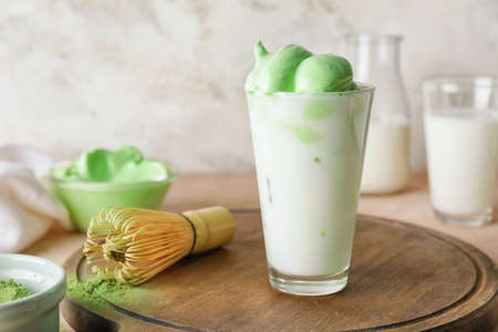 Composition with tasty dalgona matcha latte on table