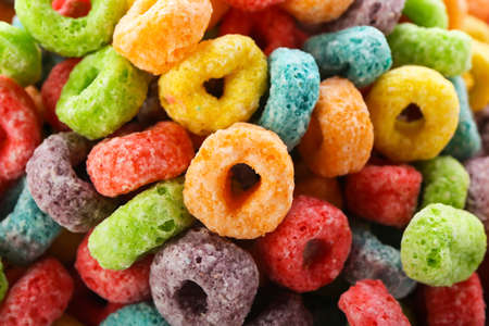 Tasty cereal rings as background, closeup
